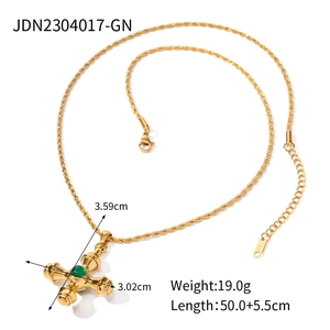 Detail of 18k gold cross necklace with tiger eye stone, lobster clasp, and dimensions