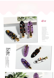 Detailed Halloween hair clips featuring pumpkin and bat motifs with golden metal duckbill clips