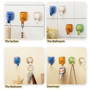 Adhesive wall hooks in four colors with round base and U-shaped metal hook for home storage