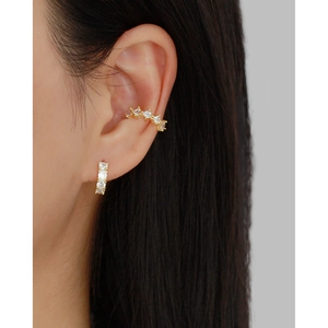 Elegant S925 sterling silver hoop earrings with cubic zirconia worn by a model