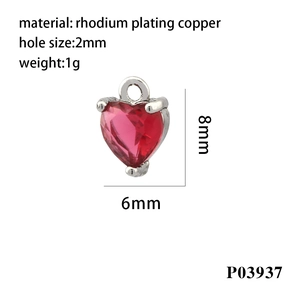 Close-up of heart-shaped red gemstone pendant charm with 18K gold plating for jewelry
