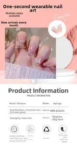 Close-up of pink gradient press-on nails with 3D butterflies and pearl accents