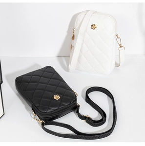 Detailed view of quilted faux leather phone bags with golden flower hardware in black and white