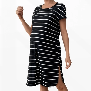 Close-up of black and white striped maternity dress with side slit and soft fabric