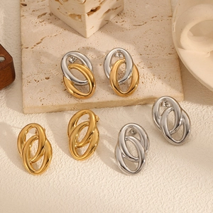 Three pairs of interlocking oval hoop earrings in gold, silver, and two-tone finishes