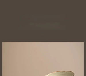 Close-up of celadon Ru Kiln ceramic tea cup featuring a wavy petal-shaped rim design
