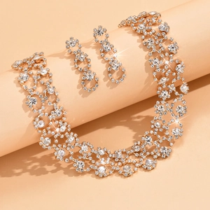 Sparkling crystal bridal jewelry set with necklace and earrings in gold-tone plating