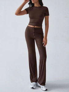 Detail of dark brown short sleeve t-shirt and casual straight pants with drawstring waist