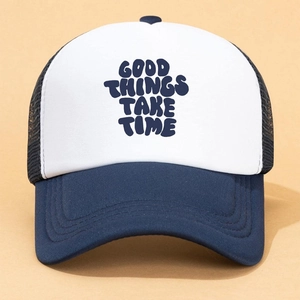 Detail of Good Things Take Time print on a two-tone blue and white mesh trucker hat