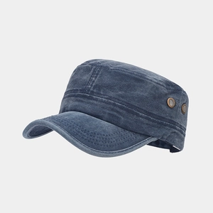 Detail of navy washed cotton cadet cap showing side profile and metal ventilation eyelets