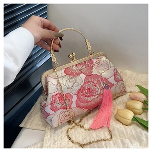 Detail of pink peony embroidery and long silk tassel on a Chinese style shell bag