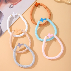 Set of 6 bohemian stretch heishi bead bracelets with cross charms and gold accents