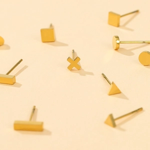 Assorted geometric stainless steel stud earrings in polished gold finish with various shapes