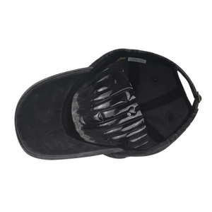 Detail of washed cotton baseball cap featuring internal structure and metal strap buckle