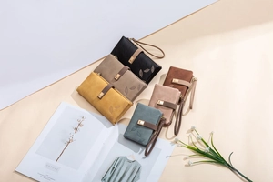Detailed view of long and short frosted leaf wallets in various vintage matte colors