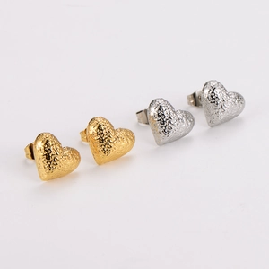 Polished stainless steel heart stud earrings in gold and silver with textured surface