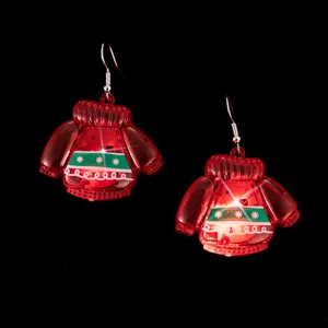 Luminous red LED Christmas sweater earrings with glowing snowflake patterns on black background