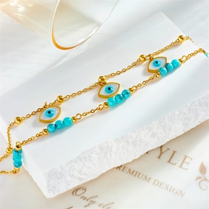 Double-layered gold chain anklet with turquoise beads and evil eye star pendant
