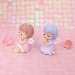 Cute resin angel cake toppers with long rabbit ears and wings for birthday decorations