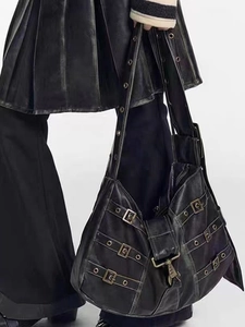 Gothic style black faux leather tote bag with punk belt buckle details and hardware