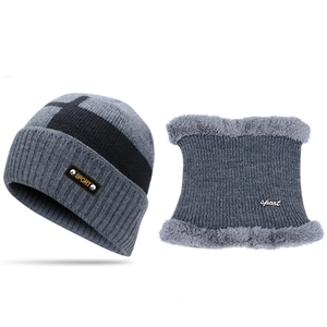 Detail of winter knitted hat and neck gaiter set with thick faux fur lining and sport patch