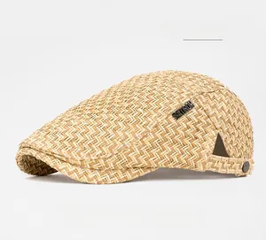 Detailed view of the fine straw weave texture and vintage metal logo on this sun hat