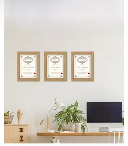 Modern minimalist solid wood photo frames set on a white wall for interior home decor