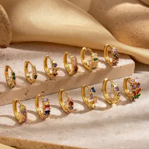 Collection of twelve gold plated huggie hoop earrings with colorful zircon gemstones