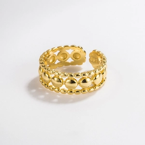 Detailed macro view of S925 sterling silver stamp on golden beaded open ring