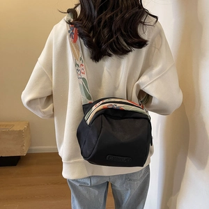 Black nylon crossbody shell bag with colorful floral wide shoulder strap for women
