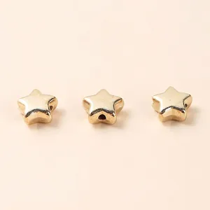 Three gold-plated acrylic star beads with center holes for DIY jewelry making