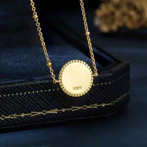 Elegant gold-plated S925 sterling silver necklace with a beaded edge round pendant