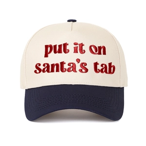 Close-up of Put It on Santa's Tab red embroidery on beige and navy baseball cap