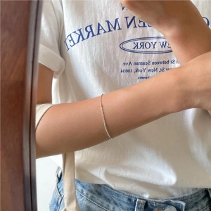Mirror selfie showing the 925 sterling silver beaded bracelet with colorful accents on wrist