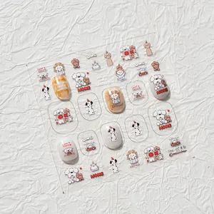 Detail of cartoon dog and girl nail art stickers set with orange and white patterns