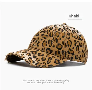 Close-up of distressed leopard print baseball cap featuring khaki frayed edge details