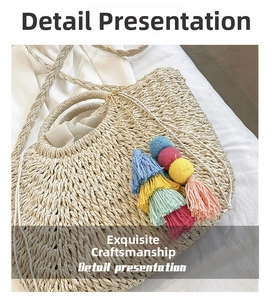 Detail view of woven straw beach bag featuring colorful tassels and round handles