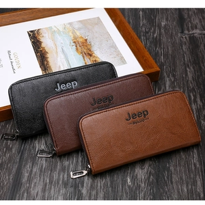 Detailed view of three long wallets with pebble grain leather texture and zip closure
