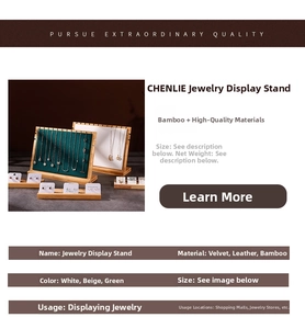 Detail of bamboo jewelry display board with emerald green and beige velvet finish