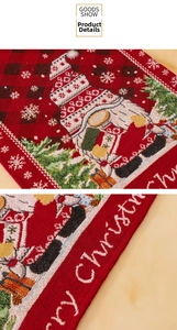 Close-up of red plaid table runner with Merry Christmas jacquard and gnome motifs