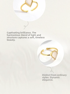 Detail of adjustable gold ring featuring a kite-shaped white opal-like gemstone
