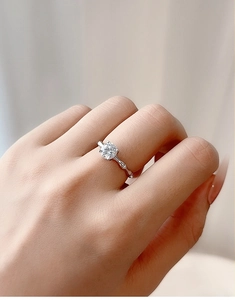 Detail of S925 sterling silver ring with 1ct round moissanite and textured bamboo band