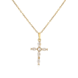 Macro detail of gold-plated cross necklace featuring shimmering marquise zircon stones