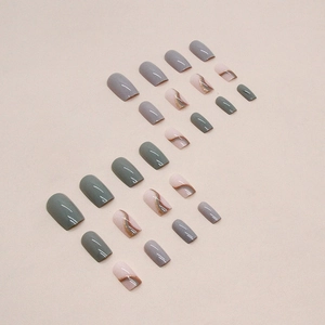 Jade grey and bean green press-on nails with wave patterns and gold glitter accents