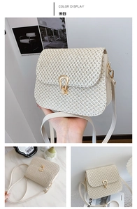 Detail of cream white woven crossbody bag with golden metal lock and thin leather strap