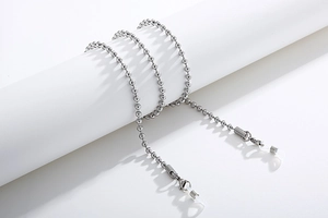 Detail view of silver stainless steel ball chain eyewear holder with silicone loops