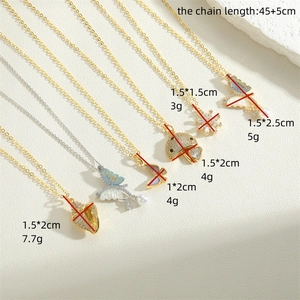 Elegant gold and silver pendant necklaces featuring butterfly, mushroom, and shell designs