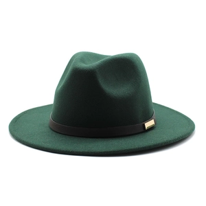 Detail of dark green wool fedora with a black leather band and gold metal buckle
