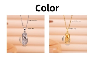 Detail view of crystal-encrusted baby shoe pendant with precise size and weight measurements
