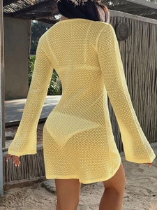 Rear view of yellow crochet knit long sleeve dress for beach cover up styling